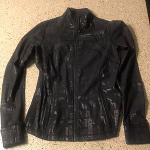 Black jacket with shiny black lettering. Like new.